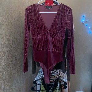 Bodysuit from baby blush. Size medium. Color maroon.